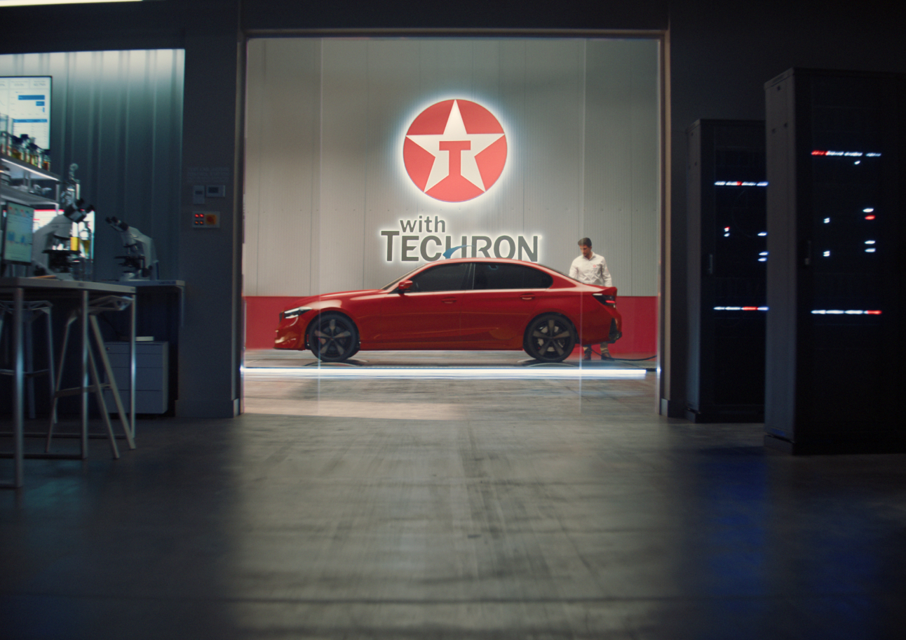 Red Car with Techron logo above