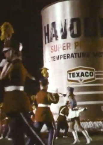 Texaco display on a marching bandMarching band on a field with the Texaco logo on the back. Texaco display on a marching bandMarching band on a field with the Texaco logo on the back.